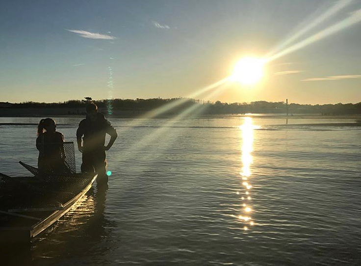 Image of Brendan Campbell working on an oyster farm in Delaware Bay.