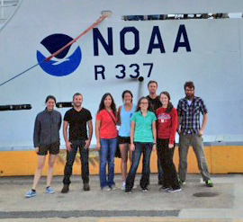 interns in front of ship