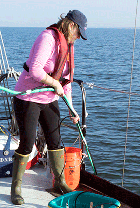 Ecologist Lora Harris collecting water samples