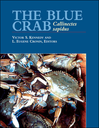 Cover of The Blue Crab: Callinectes sapidus. Showing a picture of crabs in a bushel, bordered by blue and the title. 