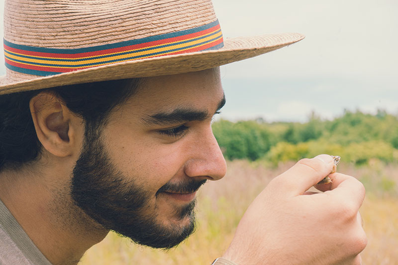 Holding a juvenile leopard frog at Pickering Creek Audubon Center, where I taught youth environmental programs and helped develop educational resources for teachers. Credit: Photo courtesy of Julian Segovia