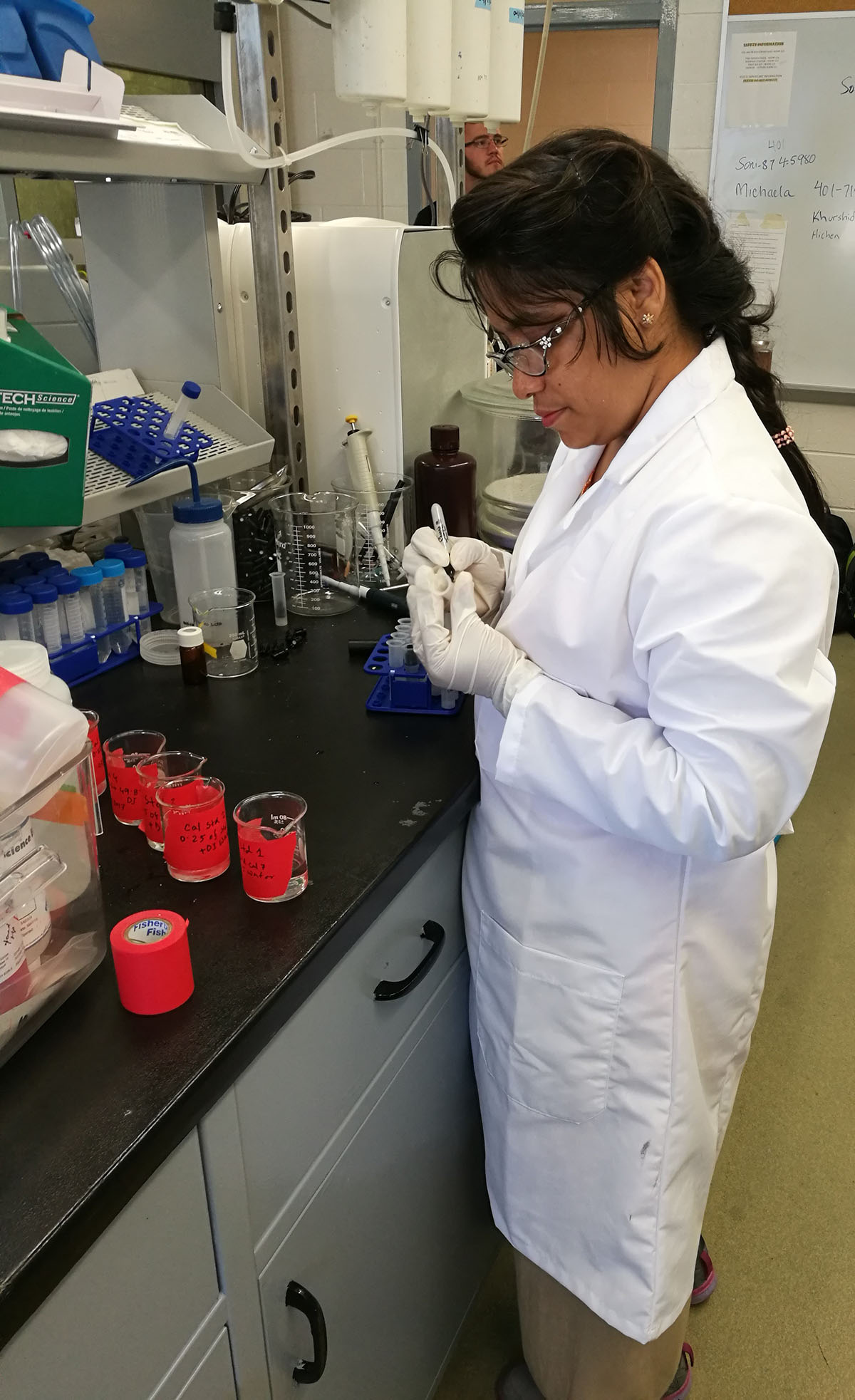 Khurshid Jahan prepares the collected stormwater runoff sample for further analysis with ion chromatography in Rhode Island as part of her graduate work. Photo credit: Tanjil Ahmed  