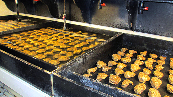 This is the room where it happens. Stephanie Alexander and her team set oysters on a spawning table.