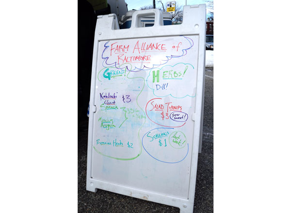 sign advertising greens for sale from the Farm Alliance of Baltimore