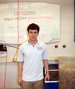 photo of Tuvia Rappaport at Baltimore Polytechnic Institute aquaponics lab