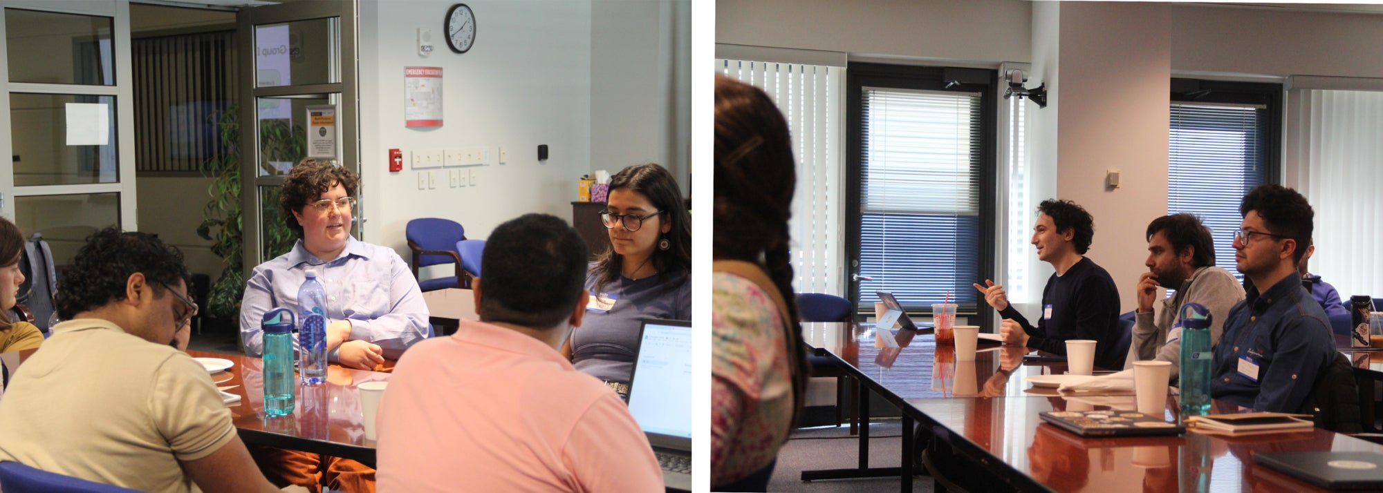 Researchers sit around tables in a conference room in discussion