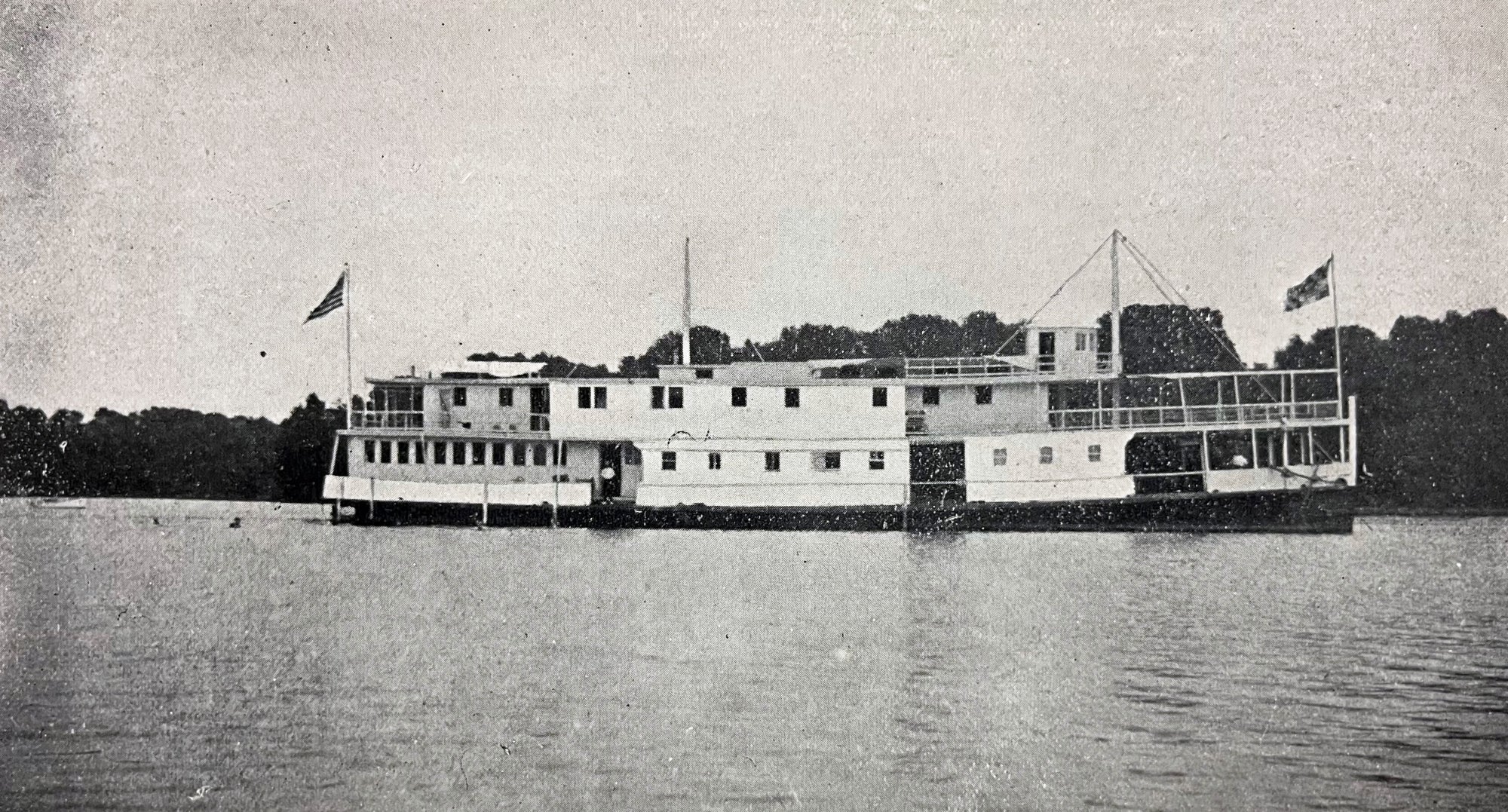 The houseboat "Oyster" flying US and Maryland flags