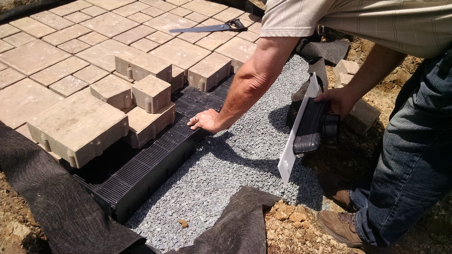 After the team put the plants into the garden, Cecil DPW workers returned another day to install three observation decks using permeable paving stones. The pavers were placed on top of a special foundation of plastic meshwork to provide temporary storage and allow stormwater to infiltrate into the soil. Photo: Eric Buehl