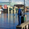 man looking at flooded street in Annapolis