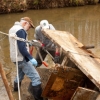 two men working in a creek