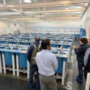 Conference participants tour a salmon aquaculture facility.