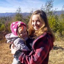 Sylvia Jacobson poses outdoors for a photo with her daughter.