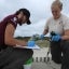 MCC Crew Leader Erin Swale (right) works with MCC member Derek Cross to record the location and details of a foil “Happy Birthday” balloon found on a dune on Assateague Island. Photo credit: Wendy Mitman Clarke / MDSG