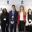 A group of law students pose together during a symposium