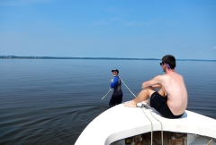 Emily pulling a boat during field work because the Susquehanna Flats are too shallow to motor through the seagrass bed. Credit: Cassie Gurbisz