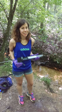 Katie sampling septic tanks