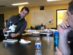 J. Adam Frederick reviews microscopic techniques with teachers at South Carroll High School.