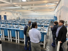 Conference participants tour a salmon aquaculture facility.