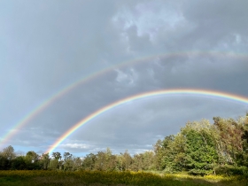 A double rainbow appears over the Great Allegheny Passage Trail in Frostburg, Maryland.