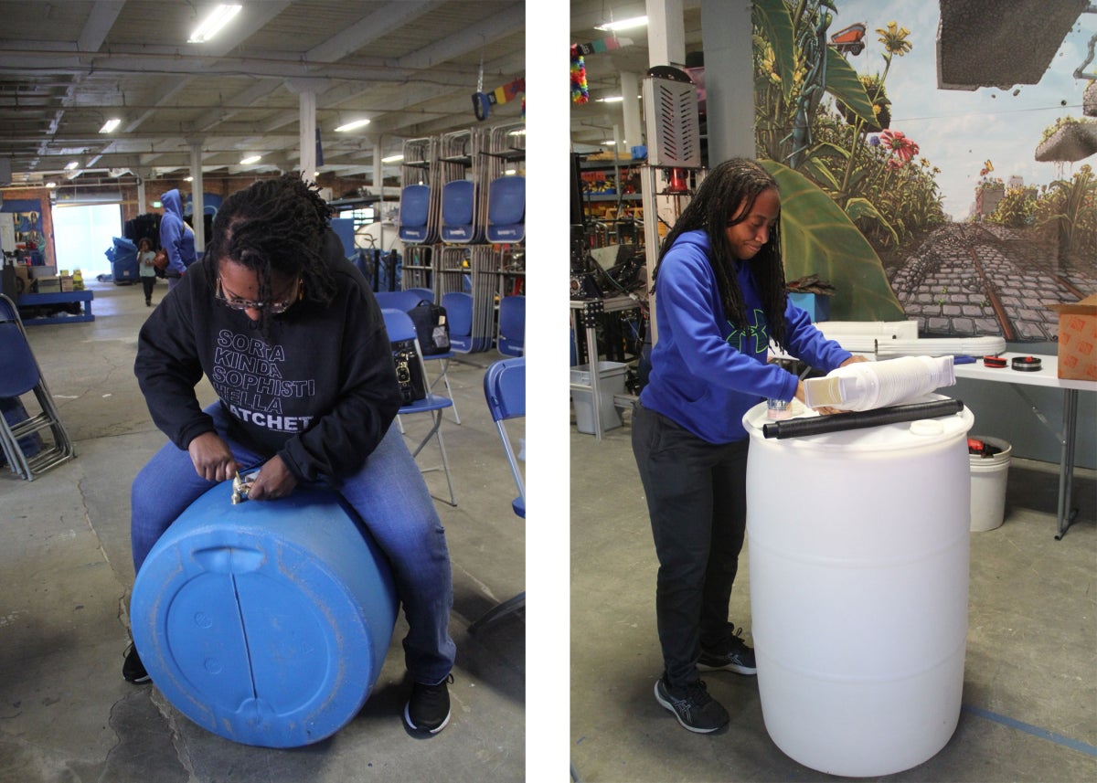 Left: a woman straddles a rain barrel to attach a spigot to its base; right: a woman stands with a rain barrel she's constructing