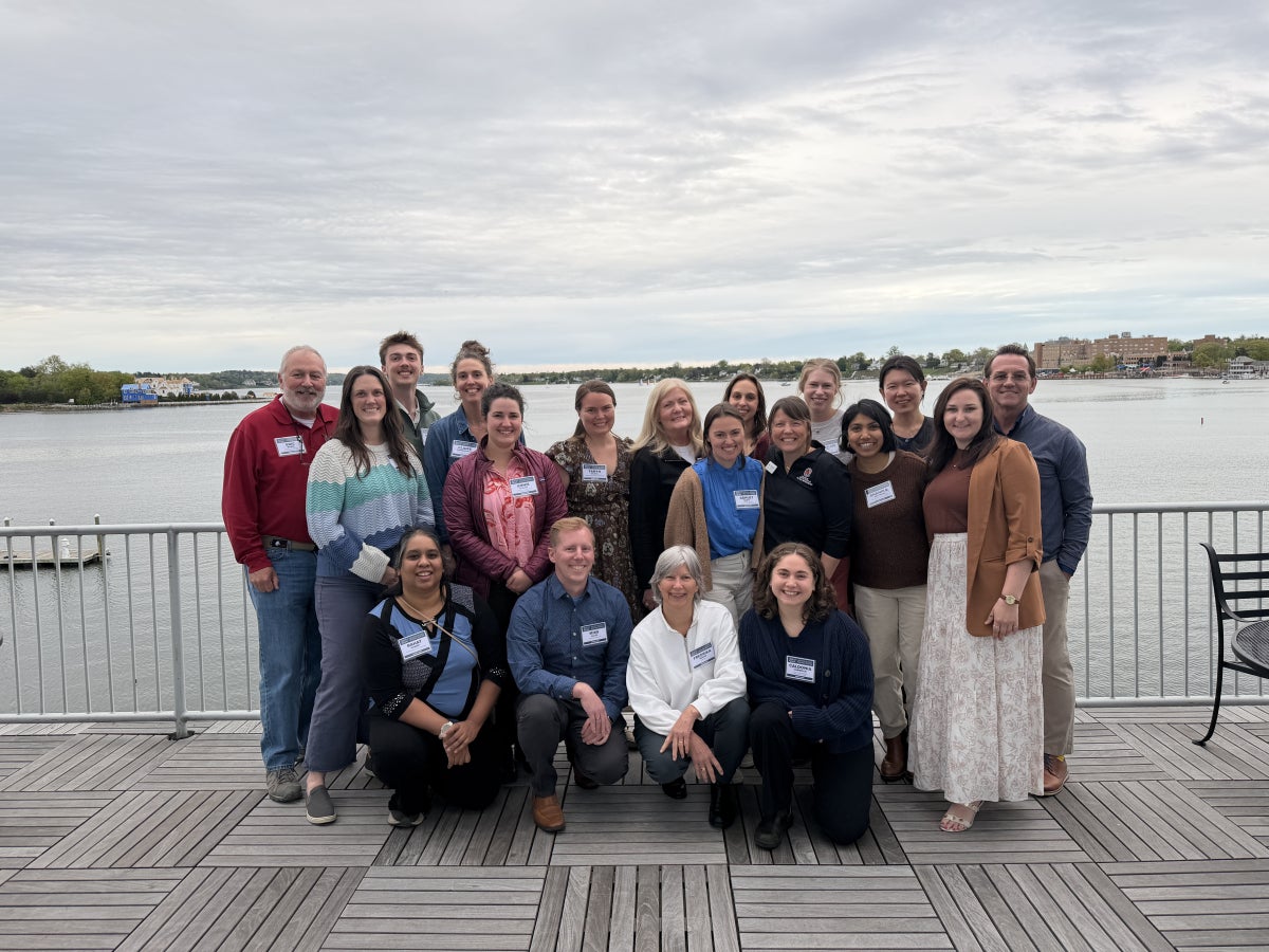Maryland Sea Grant staff together on a deck overlooking a body of water
